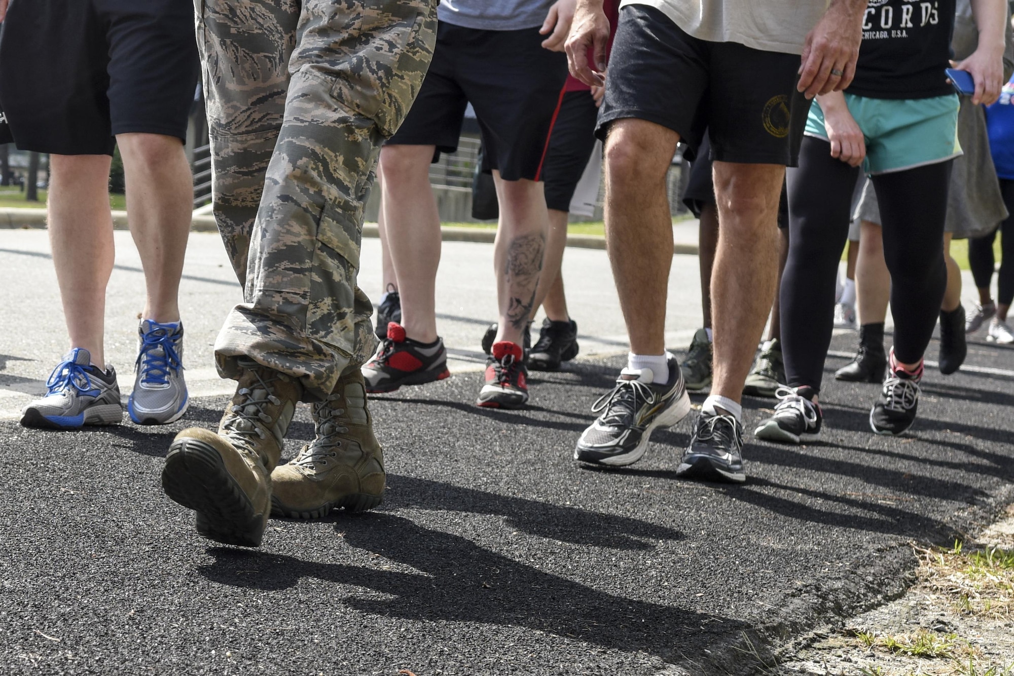 Airmen from Team Seymour begin a two-mile walk in remembrance of the Holocaust, May 4, 2016, at Seymour Johnson Air Force Base, North Carolina. Airmen walked in remembrance of the Holocaust and the more than six million people who were killed during that time. (U.S. Air Force photo by Airman Shawna L. Keyes/Released)