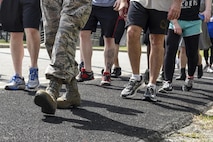 Airmen from Team Seymour begin a two-mile walk in remembrance of the Holocaust, May 4, 2016, at Seymour Johnson Air Force Base, North Carolina. Airmen walked in remembrance of the Holocaust and the more than six million people who were killed during that time. (U.S. Air Force photo by Airman Shawna L. Keyes/Released)