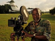 U.S. Air Force Ret. SMSgt (Ret) Mitchell Jenkins, Resource Management Officer, 1st Combat Camera Squadron served as a combat videographer from 10 Oct 68 to 1 Aug 89.  During his military career served two tours of duty in Southeast Asia as an aerial and ground combat documentation cameraman.  He flew over 100 combat missions in some 10 different air frames.  As an E-4, he was awarded the Distinguish Flying Gross, (4) Air Medals, and the Outstanding Unit Citation with “V” device.  Sgt Jenkins’ primary duty was Battle Damage Assessment (BDA) photographer with the 16th Special Operations Squadron onboard a C-130 Gunship, (SPECTRE).  His secondary duties included alert photographer for air rescue missions onboard H-53 (Jolly Green Giant) helicopters.  He also flew countless Forward Air Control (FAC) missions on OV-10 aircrafts, and air strike mission on F-100 Sabers, and F-4 Phantom fighters.  In addition, he flew many C-130 re-supply missions, and Army UH-1 medical evacuation missions throughout Vietnam.  He even voluntarily flew a few Air America missions to capture the actions of US forces in Southeast Asia.  Mr. Jenkins also flew over flew over 5,000 hours in various aircraft and he participated in many operational and humanitarian missions, one major event he documented in was in 1983, Operation UGENT FURY where film was the last time used during a mission. (U.S. Air Force Photo/ Staff Sgt. Angelita M. Lawrence)(released)
