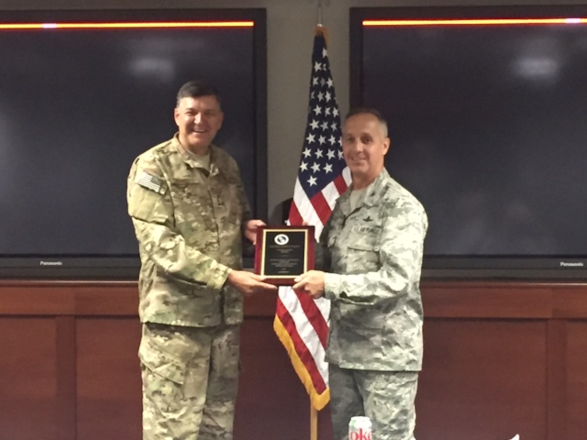 Lt. Gen. Brad Heithold, commander of Air Force Special Operations Command, presents the Cyber Safety Award to Col. Anthony Thomas, AFSOC Cyber and C4 Systems director at Hurlburt Field, Fla., May 4, 2016. (Courtesy photo)