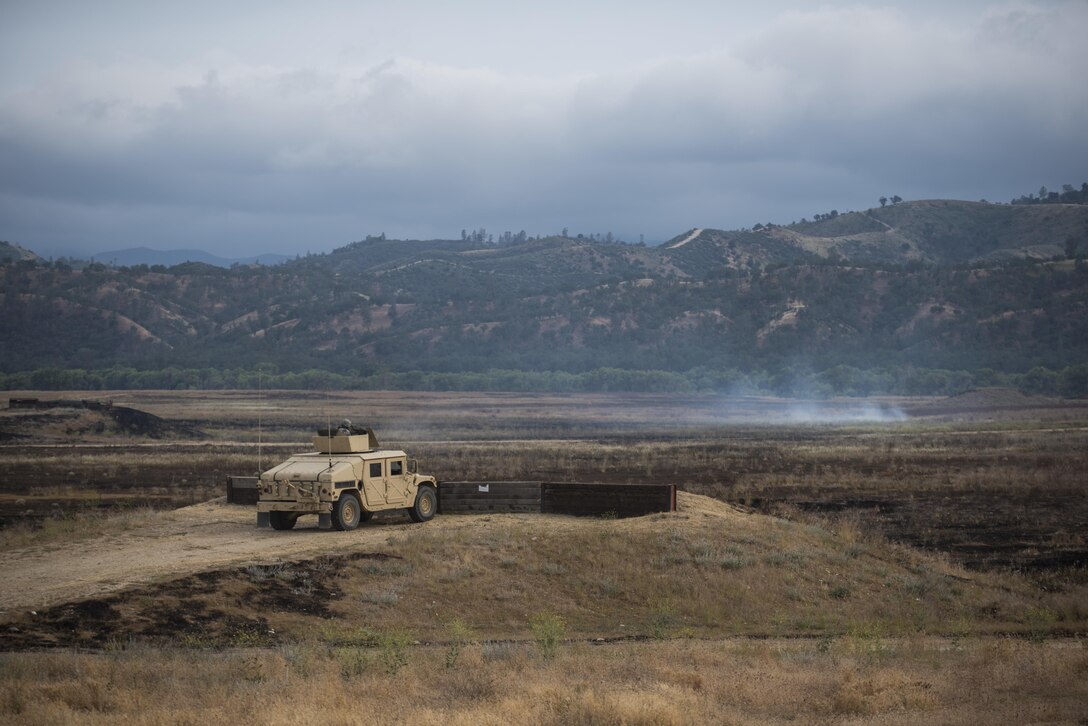 U.S. Army Reserve military police Soldiers from the 341st MP Company, of Mountain View, California, train on a mounted crew-served weapon qualification table at Fort Hunter-Liggett, California, May 4. The 341st MP Co. is one of the first units in the Army Reserve conducting a complete 6-table crew-serve weapon qualification, which includes firing the M2, M249 and M240B machine guns both during the day and night. (U.S. Army photo by Master Sgt. Michel Sauret)