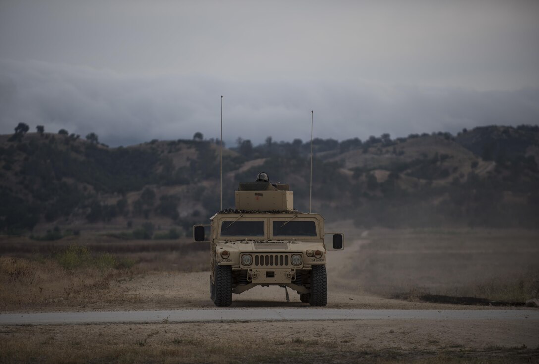 A U.S. Army Reserve military police crew from the 341st MP Company, of Mountain View, California, returns from a mounted crew-served weapon qualification table at Fort Hunter-Liggett, California, May 4. The 341st MP Co. is one of the first units in the Army Reserve conducting a complete 6-table crew-serve weapon qualification, which includes firing the M2, M249 and M240B machine guns both during the day and night. (U.S. Army photo by Master Sgt. Michel Sauret)