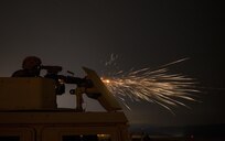 A U.S. Army Reserve military police Soldier from the 341st MP Company, of Mountain View, California, fires an M249 Squad Automatic Weapon mounted on a High Mobility Multi-Purpose Wheeled Vehicle turret during a night fire qualification table at Fort Hunter-Liggett, California, May 4. The 341st MP Co. is one of the first units in the Army Reserve conducting a complete 6-table crew-serve weapon qualification, which includes firing the M2, M249 and M240B machine guns both during the day and night. (U.S. Army photo by Master Sgt. Michel Sauret)