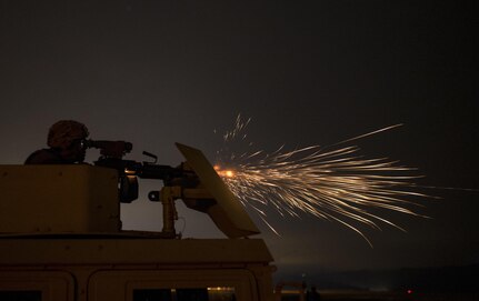 A U.S. Army Reserve military police Soldier from the 341st MP Company, of Mountain View, California, fires an M249 Squad Automatic Weapon mounted on a High Mobility Multi-Purpose Wheeled Vehicle turret during a night fire qualification table at Fort Hunter-Liggett, California, May 4. The 341st MP Co. is one of the first units in the Army Reserve conducting a complete 6-table crew-serve weapon qualification, which includes firing the M2, M249 and M240B machine guns both during the day and night. (U.S. Army photo by Master Sgt. Michel Sauret)