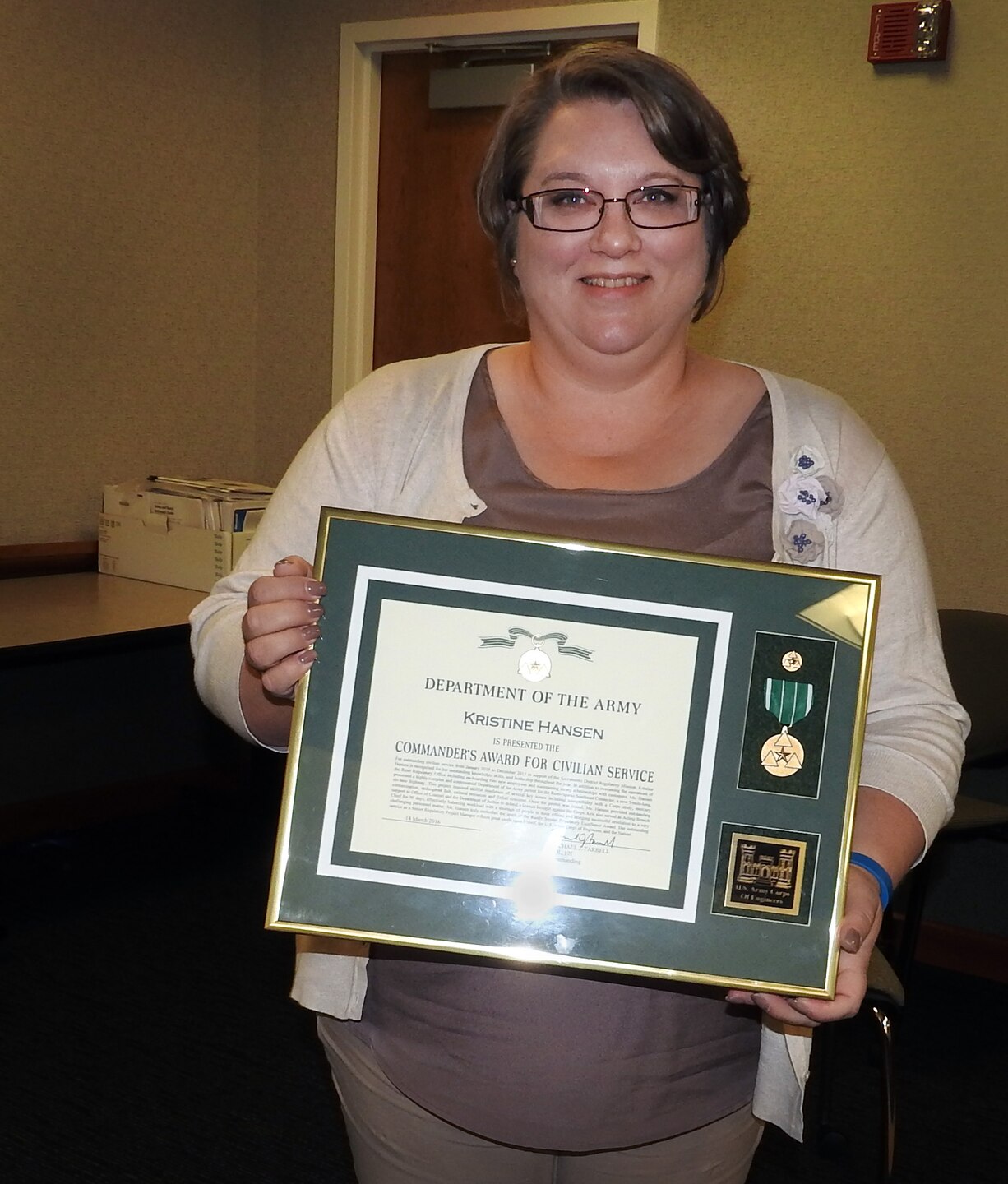 Kristen Hansen accepts award as Sacramento District Regulator of the Year. (Photo courtesy Mike Jewell)