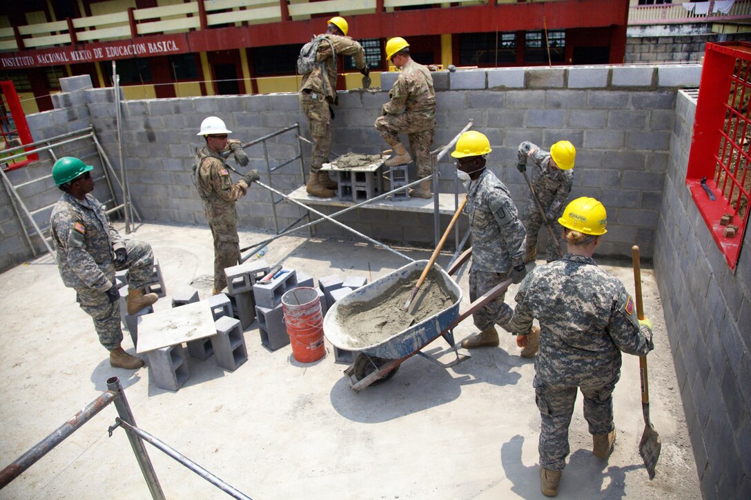 Soldiers lay bricks to build an extension to the San Rafael School as part of Beyond the Horizon 2016 in San Rafael, Guatemala, April 25, 2016. Army photo by Spc. Gabriel Prado