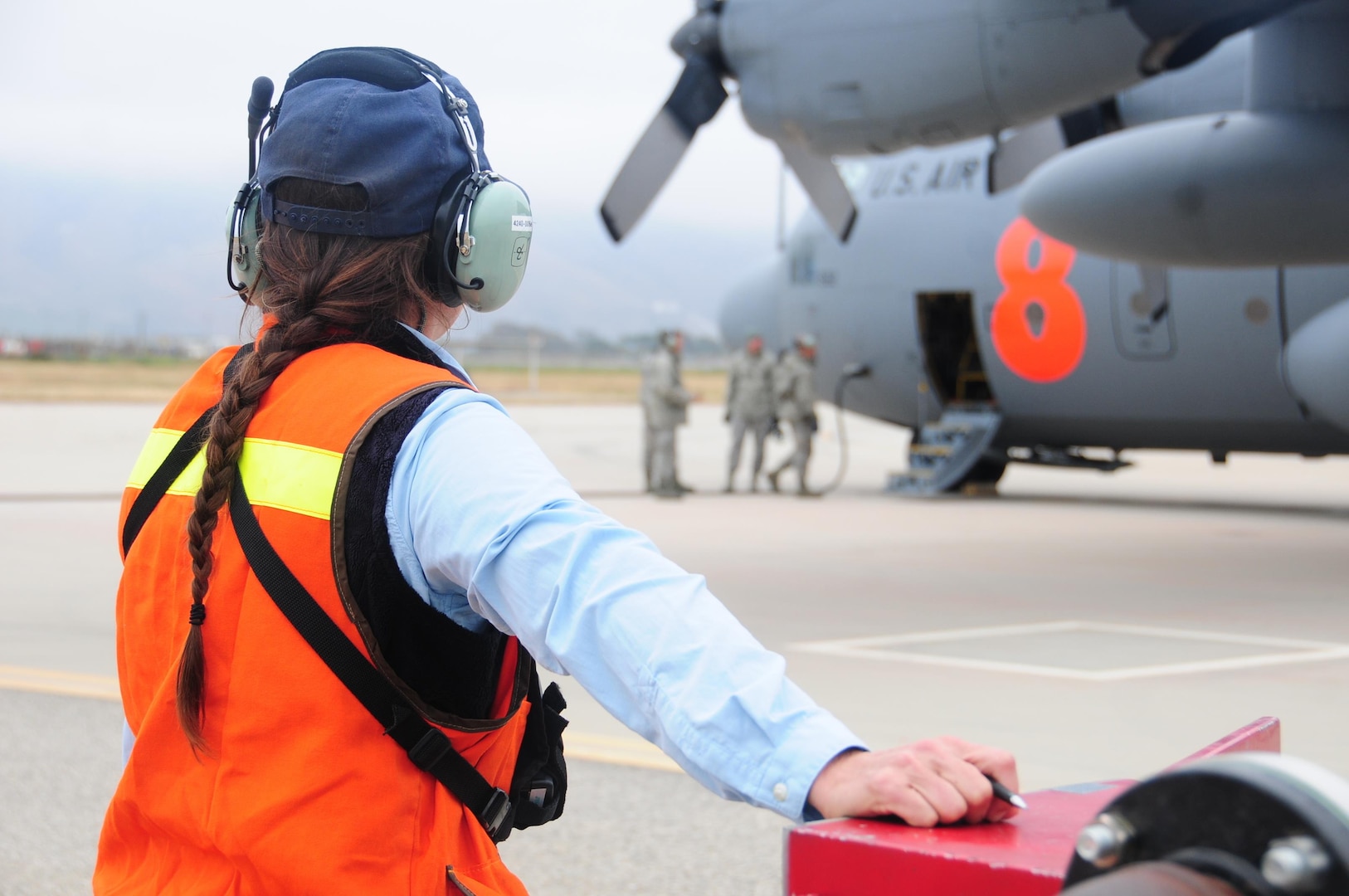 Assistant Air Base Fueler from the Santa Maria Air Tanker Base Elena Rios with U.S. Forest Service monitors water being pumped into a MAFFS unit on a C-130 air tanker during training at the 146th Airlift Wing in Port Hueneme, California on May 4, 2016. Air National Guard and Reserve units from across the U.S. convened for MAFFS (Modular Airborne Fire Fighting Systems)annual certification and training this week to prepare for the upcoming fire season in support of U.S. Forest Service.