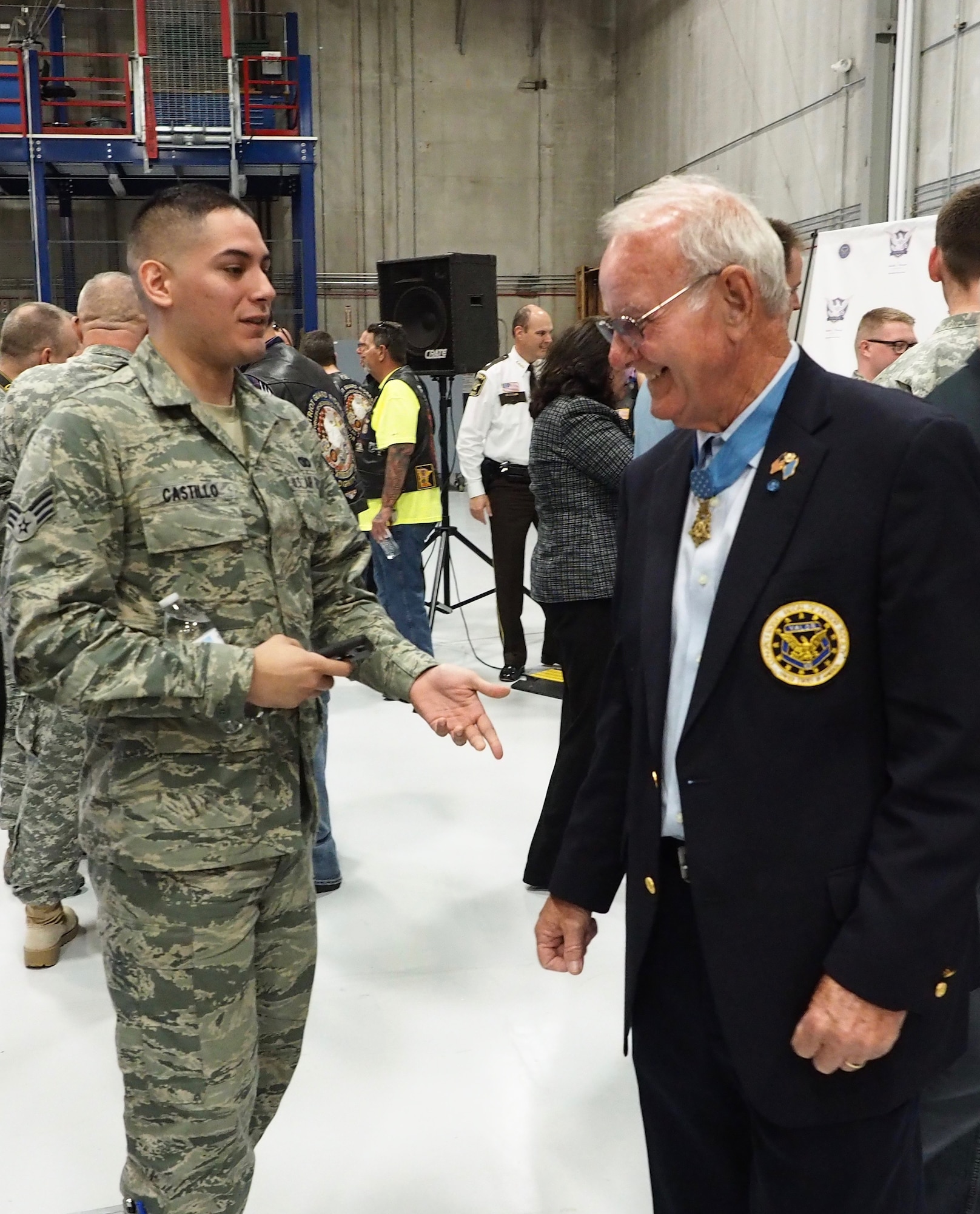 Senior Airman Raul Castillo, 934th Security Forces Squadron, talks with Medal of Honor recipient Robert Patterson. (Air Force Photo/Paul Zadach)