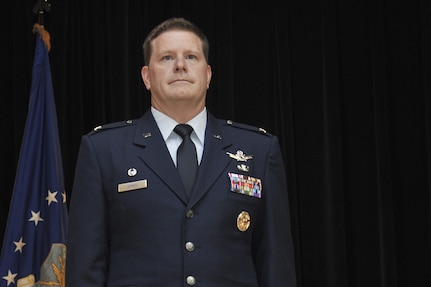 Colonel David James, 691st Intelligence, Surveillance and Reconnaissance Group commander, stands at attention as the assumption of command order is published during the 691st ISRG re-activation ceremony May 5, 2016, at Fort George G. Meade, Md. Prior to assuming command of the 691st ISRG, James held the position of Director of Cyberspace Policy, Resources and Capabilities for the Under Secretary of Defense for Intelligence, Office of the Secretary of Defense, Washington D.C. position. (U.S. Air Force photo/Staff Sgt. Alexandre Montes)