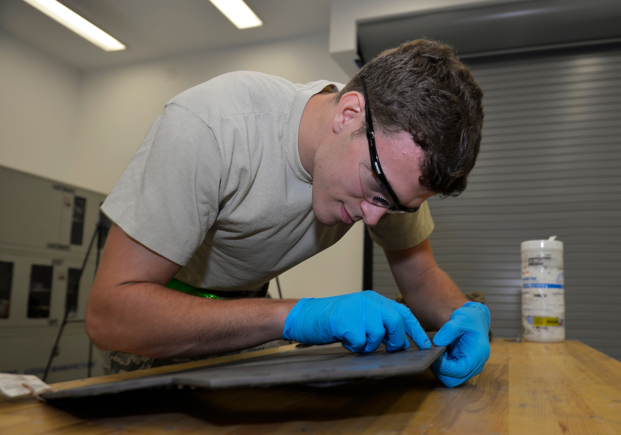 Senior Airman Tyler Quayle, 33rd Maintenance Squadron low observable maintenance journeyman, replaces a grommet on an F-35A Lightning II panel at Eglin Air Force Base, Fla., April 28, 2016. After cleaning the panel slots, Quayle places the grommet into the slot to ensure it fits properly. (U.S. Air Force photo/Senior Airman Andrea Posey)