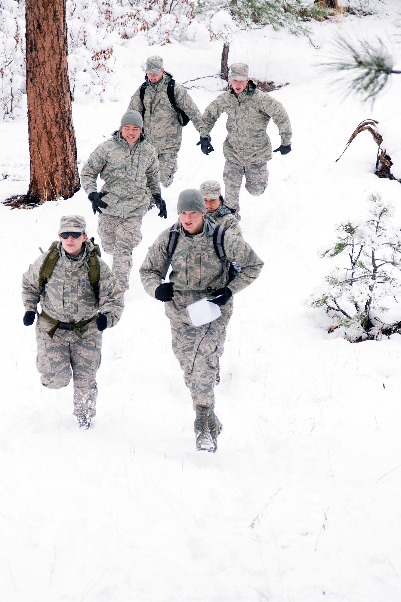 Cadets run through the snow April 30, 2016 during Polaris Warrior at the U.S. Air Force Academy. Polaris Warrior is an annual Cadet Wing Competition focusing on team-building and leadership skills. (U.S. Air Force photo/Bill Evans) 