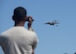 U.S. Air Force Airman 1st Class Shranil Kumar, 97th Logistics Readiness Squadron aerial delivery specialist rigger, uses a video camera to film as a U.S. Air Force C-17 Globemaster III prepares to drop a cargo platform, May 4, 2016, Duke, Okla. Riggers build each platform used for loadmaster air drop training from the ground up, including packing the parachutes, securing the cargo, loading it into the aircraft and recovering it after it has landed. (U.S. Air Force photo by Senior Airman Nathan Clark/Released)