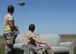 97th Logistics Readiness Squadron aerial delivery specialist riggers watch as cargo platforms are dropped from a U.S. Air Force C-17 Globemaster III at the drop zone, May 4, 2016, Duke, Okla. Riggers build each platform used for loadmaster air drop training from the ground up, including packing the parachutes, securing the cargo, loading it into the aircraft and recovering it after it has landed. (U.S. Air Force photo by Senior Airman Nathan Clark/Released)