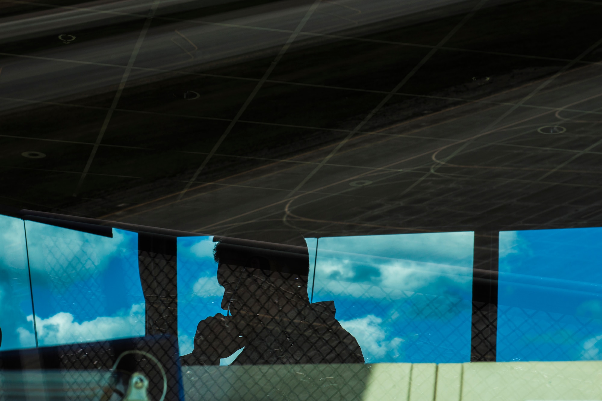 U.S. Air Force Senior Airman Eric Smith, a 354th Operations Support Squadron air traffic controller, speaks to a pilot on Eielson Air Force Base, Alaska, during RED FLAG-Alaska (RF-A) 16-1. Eielson air traffic controllers face a unique challenge during RF-A with the different style of flying pilots from other countries use compared to U.S. Air Force pilots. (U.S. Air Force photo by Staff Sgt. Joshua Turner/Released)