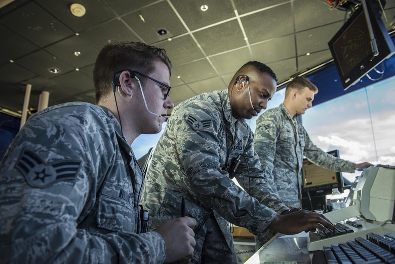 From left, U.S. Air Force Senior Airmen Robert Wallace, Anthony Marshall, and Eric Smith, all 354th Operations Support Squadron air traffic controllers, manage the air space around Eielson Air Force Base, Alaska, May 5, 2016, during RED-FLAG Alaska (RF-A) 16-1. Eielson air traffic controllers must know how to operate radio equipment to relay flight and landing instructions, weather reports and safety information to pilots. (U.S. Air Force photo by Staff Sgt. Joshua Turner/Released)