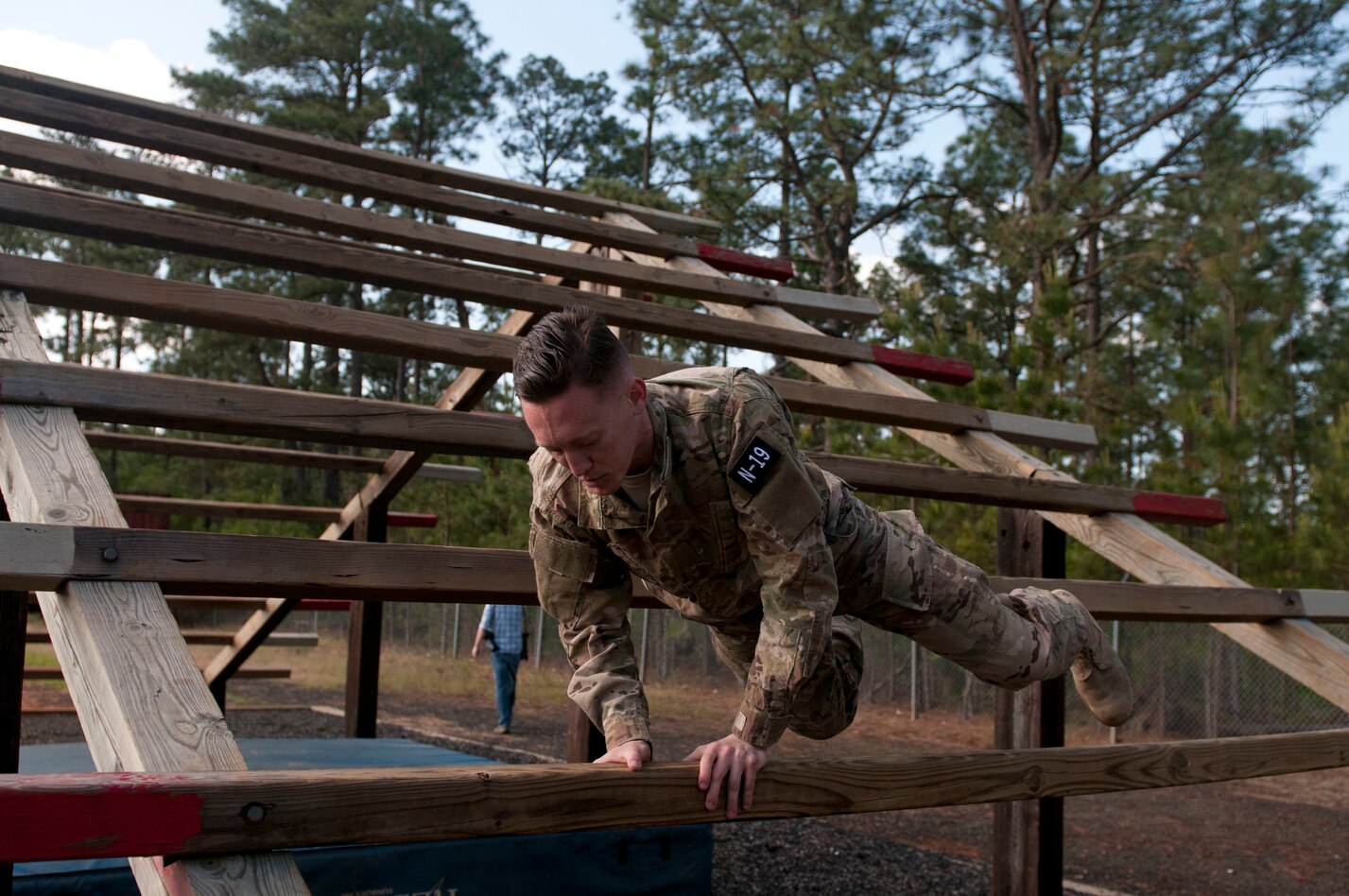 Staff Sgt. Joseph Young tackles the Weaver Obstacle during Best Warrior ...