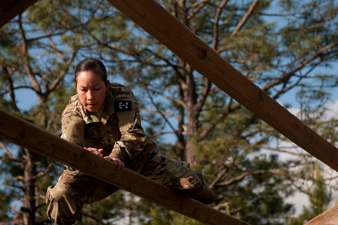 Spc. Kayla Bundy, a Wheeled Vehicle Mechanic representing the 108th Training Command (IET) navigates the Weaver at the Air Assault Obstacle Course at the 2016 U.S. Army Reserve Best Warrior Competition at Fort Bragg, N.C. May 4. This year’s Best Warrior Competition will determine the top noncommissioned officer and junior enlisted Soldier who will represent the U.S. Army Reserve in the Department of the Army Best Warrior Competition later this year at Fort A.P. Hill, Va. (U.S. Army photo by William K. Gillespie / Released)