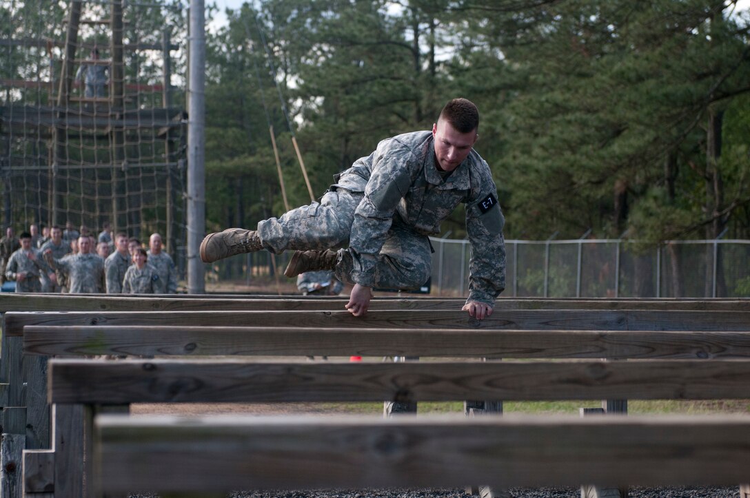 Spc. Christopher Elam, a Multichannel Transmission Systems Operator representing the  335th Signal Command (Theater) leaps over the Six Vaults at the Air Assault Obstacle Course at the 2016 U.S. Army Reserve Best Warrior Competition at Fort Bragg, N.C. May 4. This year’s Best Warrior Competition will determine the top noncommissioned officer and junior enlisted Soldier who will represent the U.S. Army Reserve in the Department of the Army Best Warrior Competition later this year at Fort A.P. Hill, Va. (U.S. Army photo by William K. Gillespie / Released)