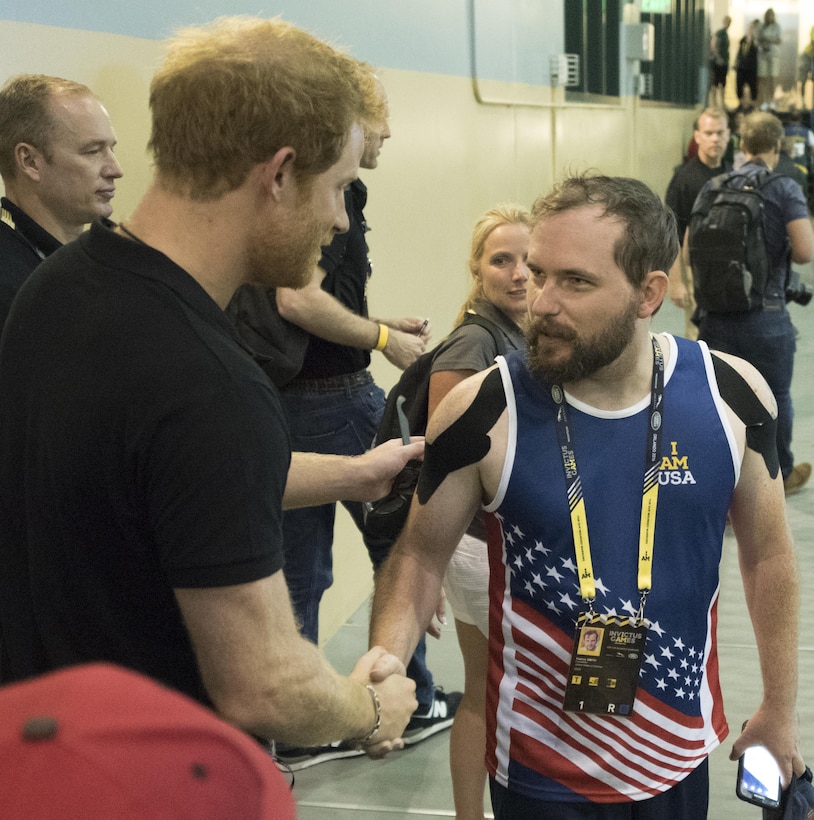 Prince Harry, left, shakes hands with retired U.S. Army Staff Sgt. Patrick Smith during training sessions at the 2016 Invictus Games in Orlando, Fla., May 6, 2016. DoD photo by Roger Wollenberg