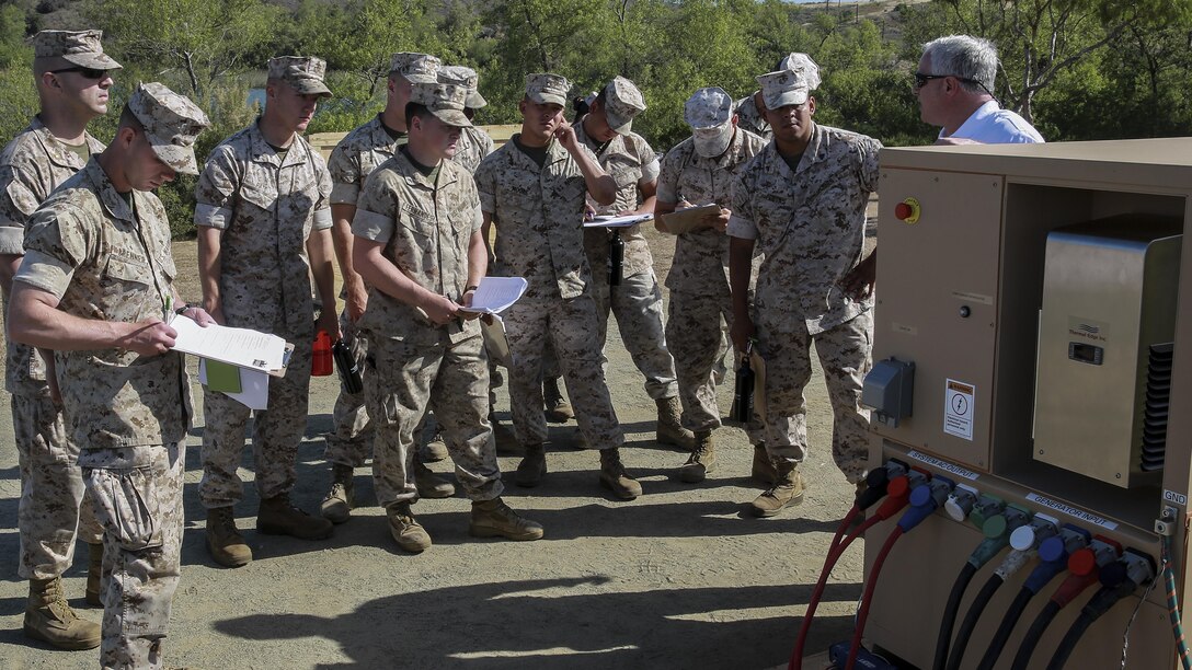 Marines learn about the capabilities of a prototype hybrid generator during the Expeditionary Energy Concepts symposium at Marine Corps Base Camp Pendleton, California May 3, 2016. E2C features new technologies developed by outside companies to improve the reach and effectiveness of the Marine Corps. The three-day event also gives Marines who would work with the technology on a daily basis the opportunity to identify possible areas for improvement. 