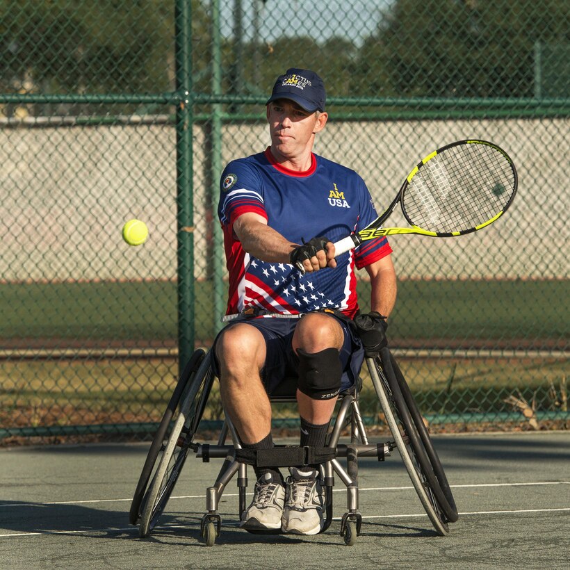 Retired Air Force Lt. Col. Dan Oosterhous and retired Navy Seaman Austin Field, not shown, compete against the British team in the tennis quarterfinals during the 2016 Invictus Games in Orlando, Fla., May 6, 2016. DoD photo by Roger Wollenberg