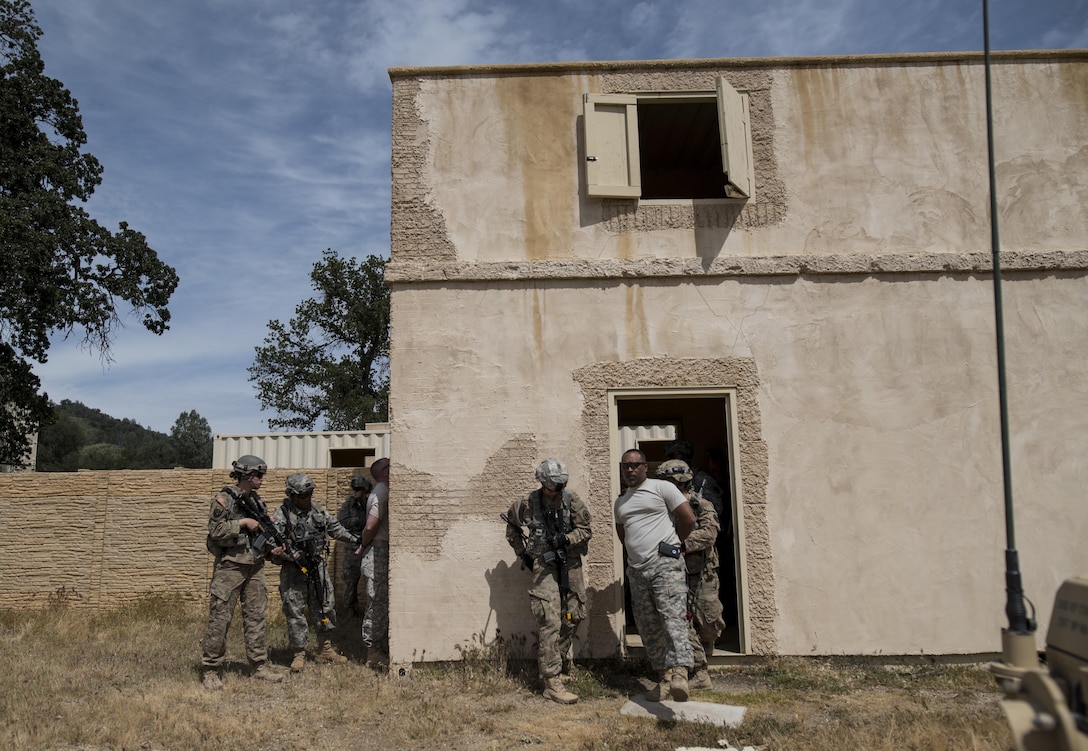 Two teams of U.S. Army Reserve military police Soldiers from the 56th Military Police Company (Combat Support), of Mesa, Arizona, find and detain two high-value targets during a cordon and search training lane at Fort Hunter-Liggett, California, May 4. Approximately 80 units from across the U.S. Army Reserve, Army National Guard and active Army are participating in the 84th Training Command's second Warrior Exercise this year, WAREX 91-16-02, hosted by the 91st Training Division at Fort Hunter-Liggett, California. (U.S. Army photo by Master Sgt. Michel Sauret)