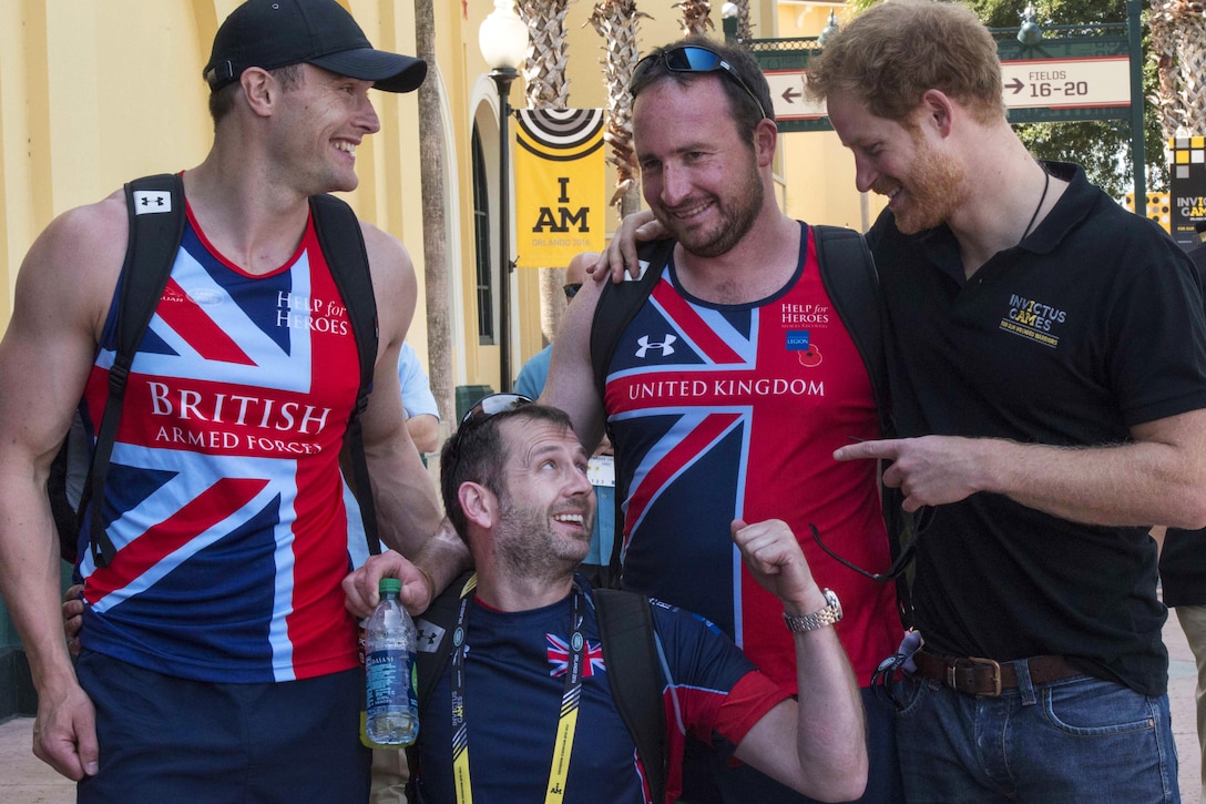 Prince Harry, right, is greeted by three British wounded warrior athletes after training sessions at the 2016 Invictus Games in Orlando, Fla., May 6, 2016. Air Force photo by Senior Master Sgt. Kevin Wallace