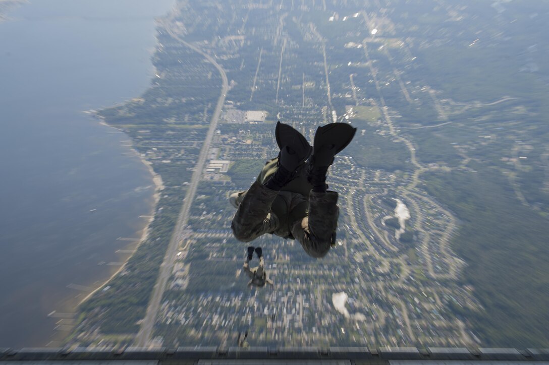 Pararescuemen and combat controllers from the 21st Special Operations Squadron and 22nd SOS, jump out of a MC-130J Commando II at Hurlburt field, Fla., May 4, 2016 during Emerald Warrior. (U.S. Air Force photo by Staff Sgt. Paul Labbe)                                                                                                                                                  