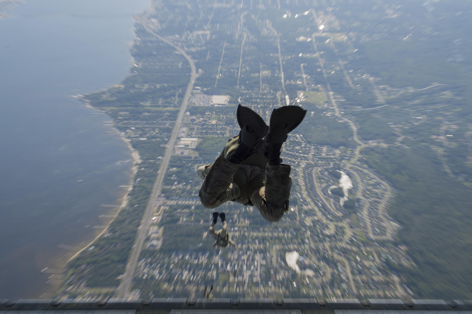 Pararescuemen and combat controllers from the 21st Special Operations Squadron and 22nd SOS, jump out of a MC-130J Commando II at Hurlburt field, Fla., May 4, 2016 during Emerald Warrior. (U.S. Air Force photo by Staff Sgt. Paul Labbe)                                                                                                                                                  