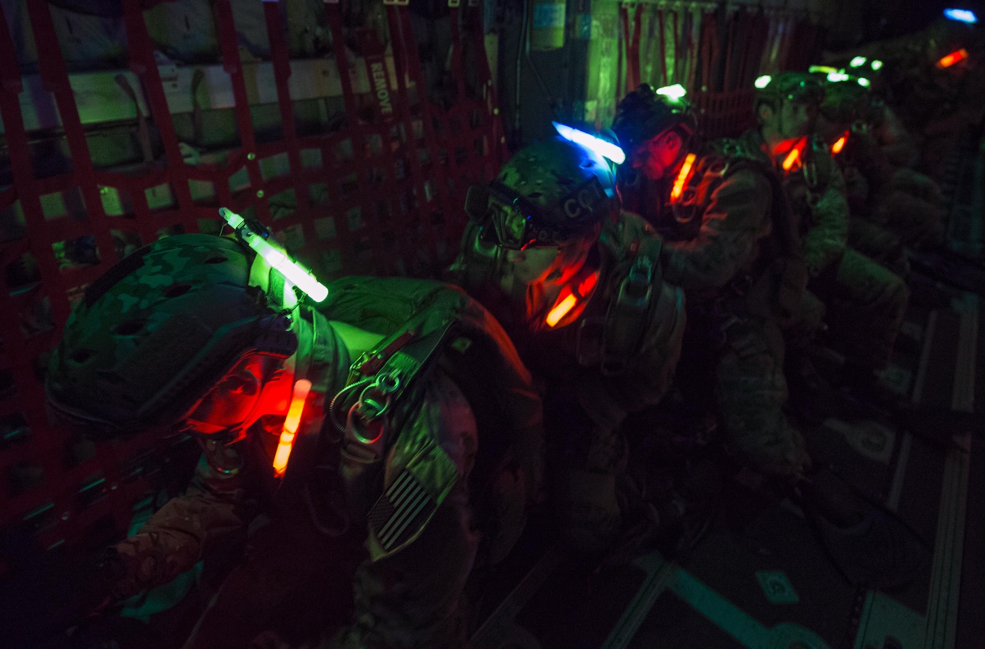 Pararescuemen and combat controllers from the 21st Special Operations Squadron and 22nd SOS conduct a parachute buddy check before jumping out of a MC-130J Commando II at Hurlburt field, Fla., May 4, 2016 during Emerald Warrior. (U.S. Air Force photo by Staff Sgt. Paul Labbe)                                                                                                          