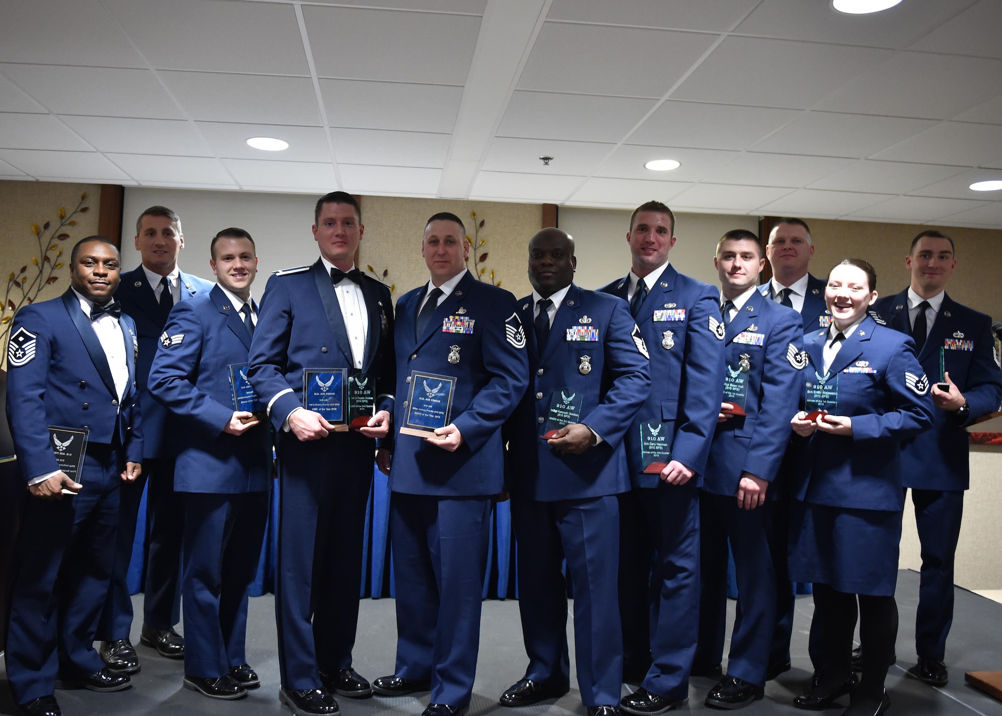 Members of the 910th Airlift Wing who received awards pose for a photo during the inaugural awards banquet here, April 2, 2016. The event recognized quarterly and yearly award winners for the year 2015. (U.S. Air Force photo/Staff Sergeant Rachel Kocin)