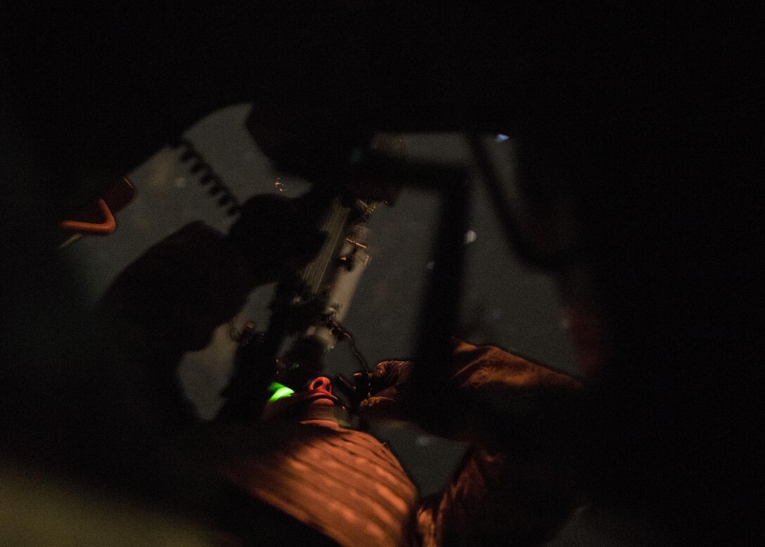 A U.S. Army Reserve military police gunner from the 341st MP Company, of Mountain View, California, scans his sector of fire during a mounted crew-served weapon night fire qualification table at Fort Hunter-Liggett, California, May 3. The 341st MP Co. is one of the first units in the Army Reserve conducting a complete 6-table crew-serve weapon qualification, which includes firing the M2, M249 and M240B machine guns both during the day and night. (U.S. Army photo by Master Sgt. Michel Sauret)