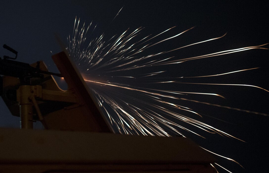 A U.S. Army Reserve military police Soldier from the 341st MP Company, of Mountain View, California, fires an M249 Squad Automatic Weapon mounted on a High Mobility Multi-Purpose Wheeled Vehicle turret during a night fire qualification table at Fort Hunter-Liggett, California, May 4. The 341st MP Co. is one of the first units in the Army Reserve conducting a complete 6-table crew-serve weapon qualification, which includes firing the M2, M249 and M240B machine guns both during the day and night. (U.S. Army photo by Master Sgt. Michel Sauret)