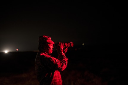 A U.S. Army Reserve military police Soldier from the 341st MP Company, of Mountain View, California, looks down range using a machine gun night scope during a mounted crew-served weapon qualification table at Fort Hunter-Liggett, California, May 4. The 341st MP Co. is one of the first units in the Army Reserve conducting a complete 6-table crew-serve weapon qualification, which includes firing the M2, M249 and M240B machine guns both during the day and night. (U.S. Army photo by Master Sgt. Michel Sauret)