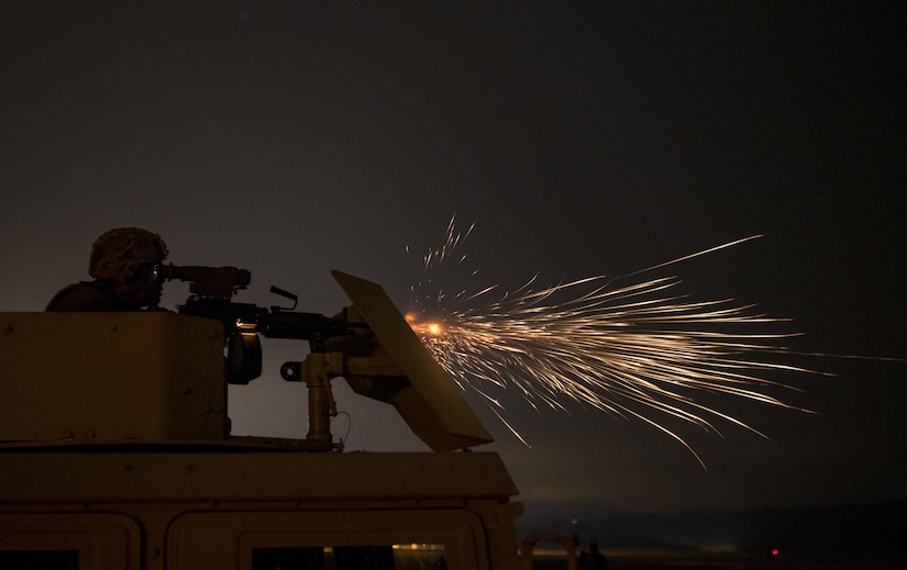 A U.S. Army Reserve military police Soldier from the 341st MP Company, of Mountain View, California, fires an M249 Squad Automatic Weapon mounted on a High Mobility Multi-Purpose Wheeled Vehicle turret during a night fire qualification table at Fort Hunter-Liggett, California, May 4. The 341st MP Co. is one of the first units in the Army Reserve conducting a complete 6-table crew-serve weapon qualification, which includes firing the M2, M249 and M240B machine guns both during the day and night. (U.S. Army photo by Master Sgt. Michel Sauret)