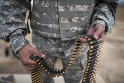 U.S. Army Reserve military police Soldiers from the 341st MP Company, of Mountain View, California, prepare an M240B machine gun for a mounted crew-served weapon night fire qualification table at Fort Hunter-Liggett, California, May 4. The 341st MP Co. is one of the first units in the Army Reserve conducting a complete 6-table crew-serve weapon qualification, which includes firing the M2, M249 and M240B machine guns both during the day and night. (U.S. Army photo by Master Sgt. Michel Sauret)