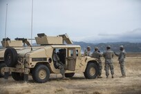 U.S. Army Reserve military police Soldiers from the 341st MP Company, of Mountain View, California, wait for their turn to go on a mounted crew-served weapon qualification range at Fort Hunter-Liggett, California, May 4. The 341st MP Co. is one of the first units in the Army Reserve conducting a complete 6-table crew-serve weapon qualification, which includes firing the M2, M249 and M240B machine guns both during the day and night. (U.S. Army photo by Master Sgt. Michel Sauret)