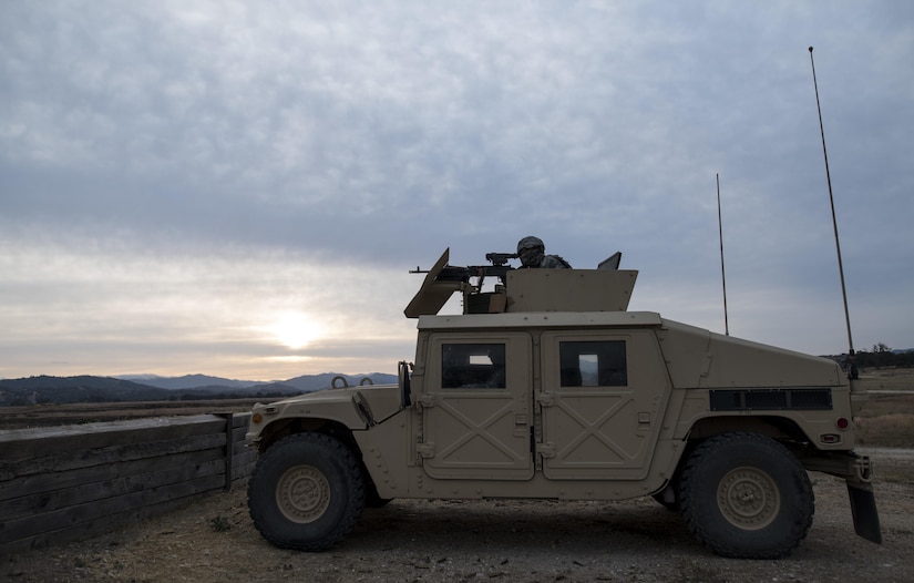 A U.S. Army Reserve military police Soldier from the 341st MP Company, of Mountain View, California, fires an M249 Squad Automatic Weapon mounted on a High Mobility Multi-Purpose Wheeled Vehicle turret during a qualification table at Fort Hunter-Liggett, California, May 4. The 341st MP Co. is one of the first units in the Army Reserve conducting a complete 6-table crew-serve weapon qualification, which includes firing the M2, M249 and M240B machine guns both during the day and night. (U.S. Army photo by Master Sgt. Michel Sauret)