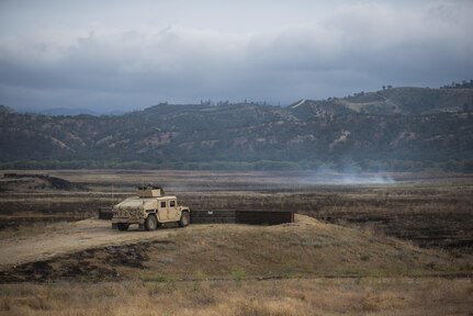 U.S. Army Reserve military police Soldiers from the 341st MP Company, of Mountain View, California, train on a mounted crew-served weapon qualification table at Fort Hunter-Liggett, California, May 4. The 341st MP Co. is one of the first units in the Army Reserve conducting a complete 6-table crew-serve weapon qualification, which includes firing the M2, M249 and M240B machine guns both during the day and night. (U.S. Army photo by Master Sgt. Michel Sauret)