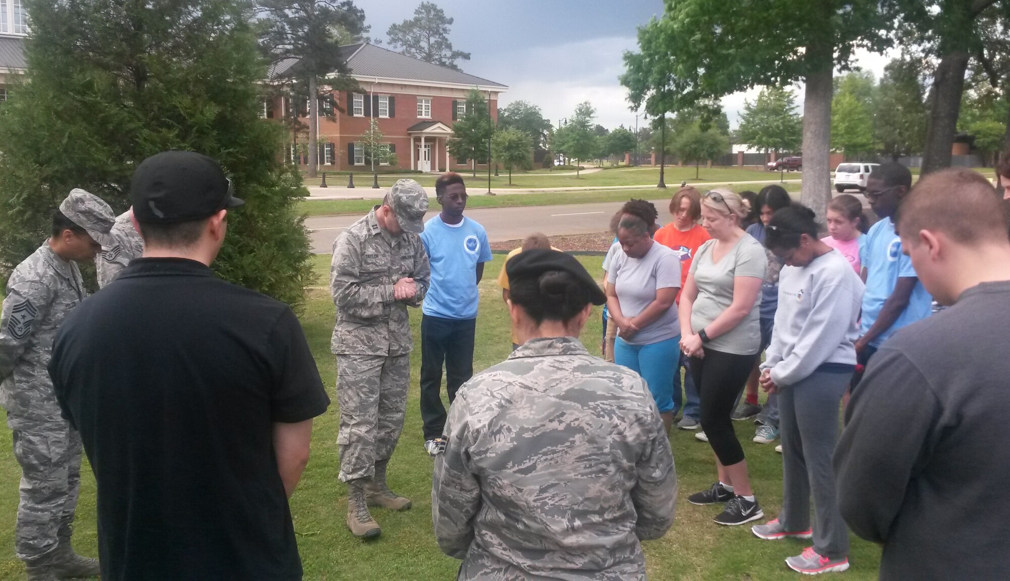 Team BLAZE members pause for a moment of silence May 4 at Columbus Air Force Base, Mississippi, in observance of the lives lost during the Holocaust. Members then took the time to commence a Vigil Walk together nearby. (U.S. Air Force photo/Senior Airman Kaleb Snay)