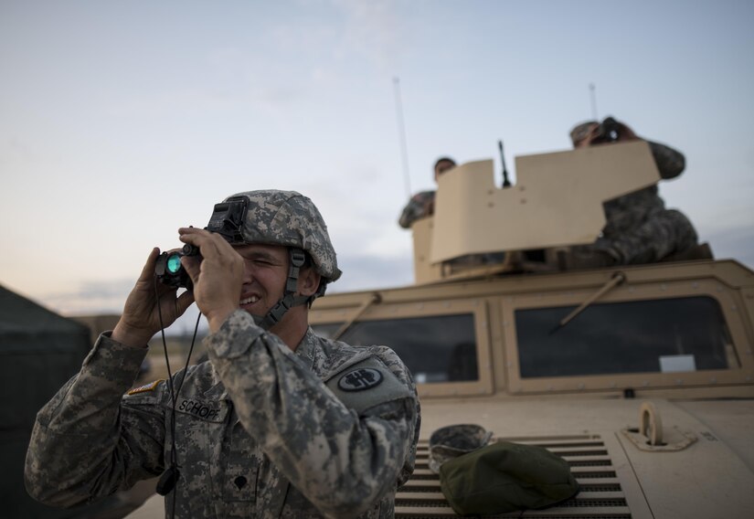 Spc. Bradley Schopf, a U.S. Army Reserve military police Soldier with the 341st MP Company, of Tracy, Califonia, tests out his night optics before a mounted crew-served weapon qualification night fire table at Fort Hunter-Liggett, California, May 3. The 341st MP Co. is one of the first units in the Army Reserve conducting a complete 6-table crew-serve weapon qualification, which includes firing the M2, M249 and M240B machine guns both during the day and night. (U.S. Army photo by Master Sgt. Michel Sauret)
