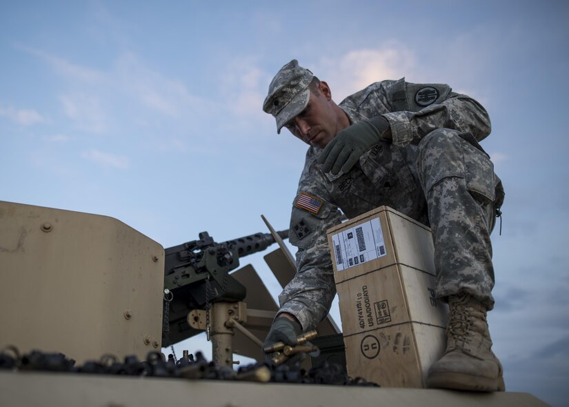 Spc. Trenton Beck, of Marysville, California, a U.S. Army Reserve military police Soldier from the 341st MP Company, of Mountain View, California, picks up .50-caliber shell casings off a vehicle roof after a M2 Bradley firing table at Fort Hunter-Liggett, California, May 3. The 341st MP Co. is one of the first units in the Army Reserve conducting a complete 6-table crew-serve weapon qualification, which includes firing the M2, M249 and M240B machine guns both during the day and night. (U.S. Army photo by Master Sgt. Michel Sauret)