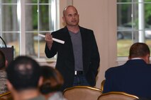 Stephen Scoggins, keynote speaker, speaks about the struggles he faced earlier in his life during the National Prayer Luncheon, May 5, 2016, at Seymour Johnson Air Force Base, North Carolina. Scoggins discussed how he believes prayer helped him get through his struggles and create a more successful life for himself. (U.S. Air Force photo by Airman 1st Class Ashley Williamson/Released)