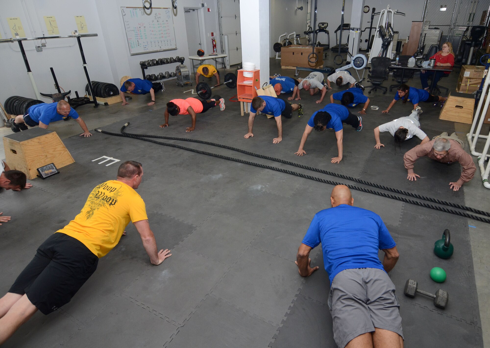 Members of the 22nd Air Force headquarters staff perform 22 synchronized push-ups in an effort to bring awareness to veteran suicides and promote suicide prevention at Dobbins Air Reserve Base, Ga., on April 22, 2016. The group also took part in a fitness challenge as part of Double Deuce Day, a day focused on team-building and held on the 22nd day of each month. (U.S. Air Force photo/Don Peek)