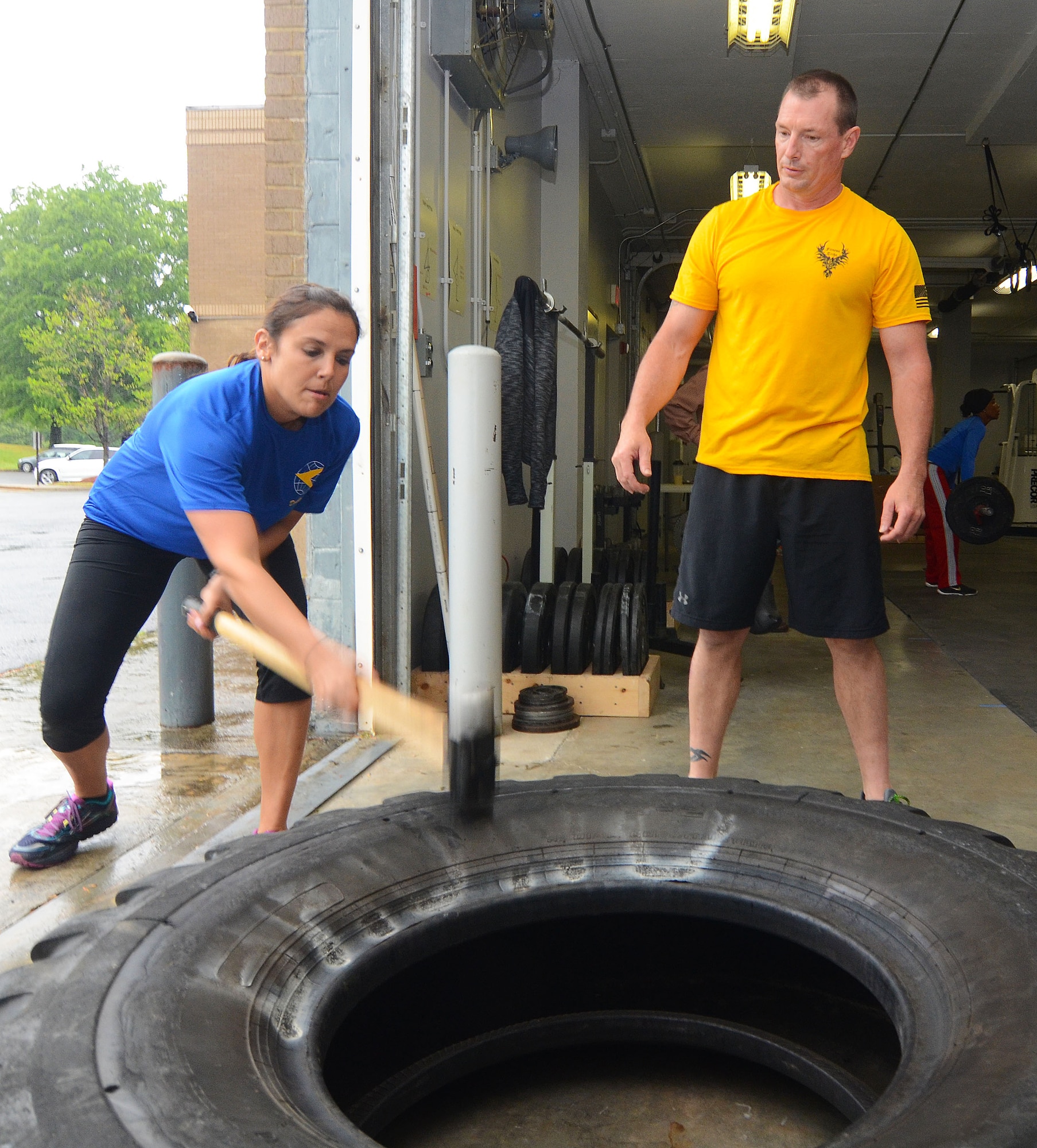 Capt. Natalie Campos and Chief Master Sgt. Jason Hawthorne take part in a fitness challenge designed to bring awareness to veteran suicides and promote suicide prevention at Dobbins Air Reserve Base, Georgia, April 22, 2016. (U.S. Air Force photo/Don Peek)