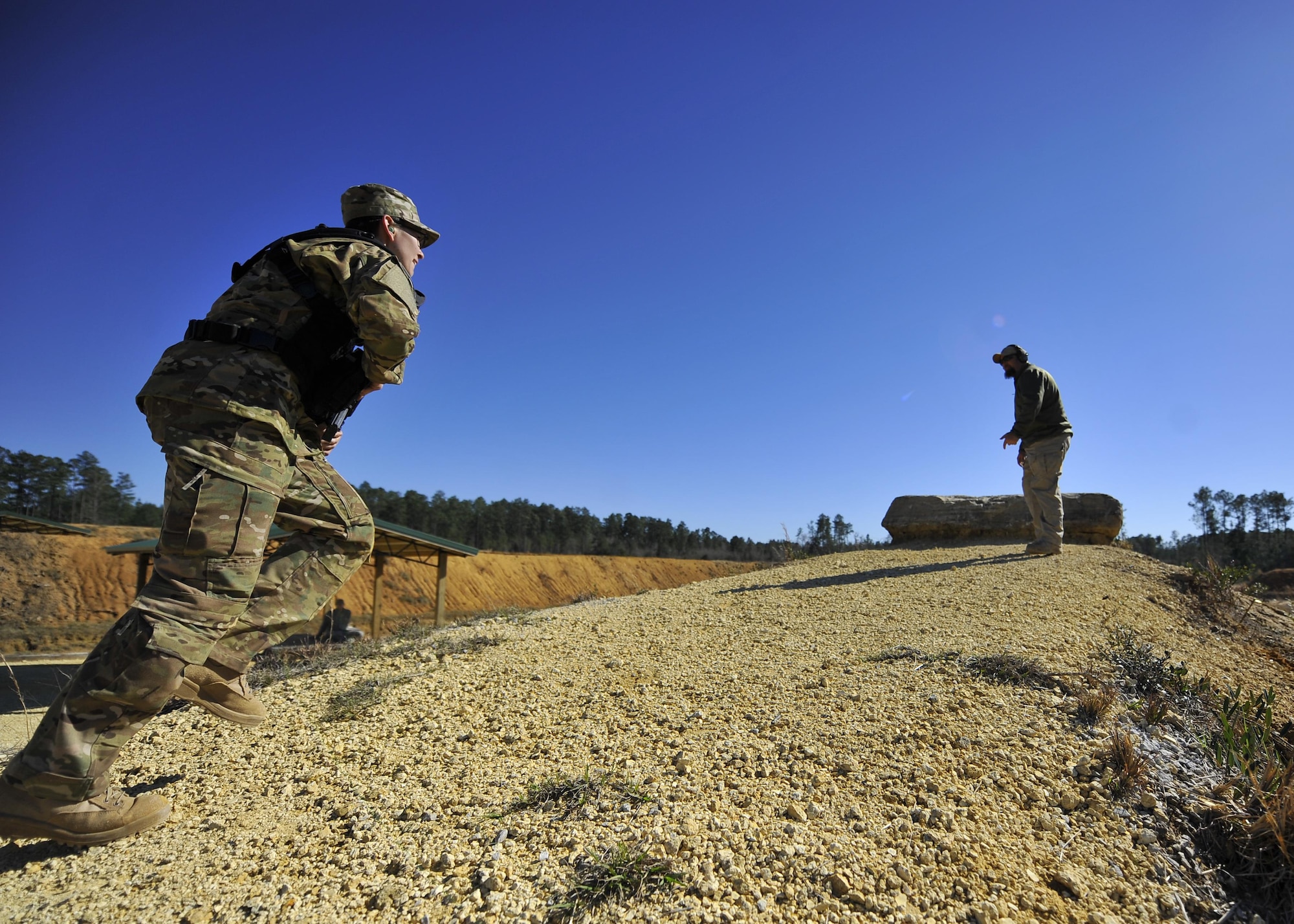 Second Lt. Blaine Driscoll, a combat systems operator with the 19th Special Operations Squadron, runs to the final station of his ‘stress test’ at a firing range near Baker, Fla., Feb. 25, 2016. During the final evolution of training, students ran a ‘stress test.’ The exercise was intended to build students’ confidence translating the drills they practiced during their three days of range time, to actuals skills they may need downrange. (U.S. Air Force photo by Airman 1st Class Kai White)