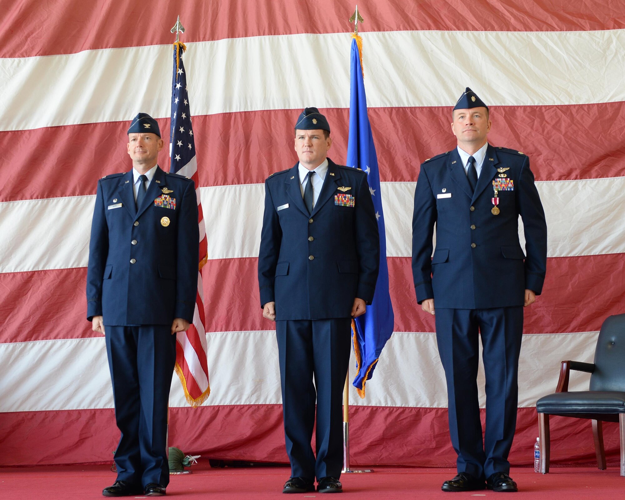 From left to right, Col. Christopher Niemi, 33rd Fighter Wing Operations Group commander, Lt. Col. Keith McGuire, incoming 337th Air Control Squadron commander, and Lt. Col. Michael Hagan, outgoing 337th ACS commander, stand at attention during the 337th ACS change of command Ceremony at Tyndall Air Force Base, Fla., May 5, 2016. The 337th ACS is a geographically seperated unit assigned to the 33rd FW/OG at Eglin AFB, Fla., operating out of Tyndall AFB. Not only is the squadron's primary responsibility to train air battle officers, they also provide command and control support for the F-22 Raptor initial and transition training. (U.S. Air Force photo/Airman 1st Class Cody R. Miller)
