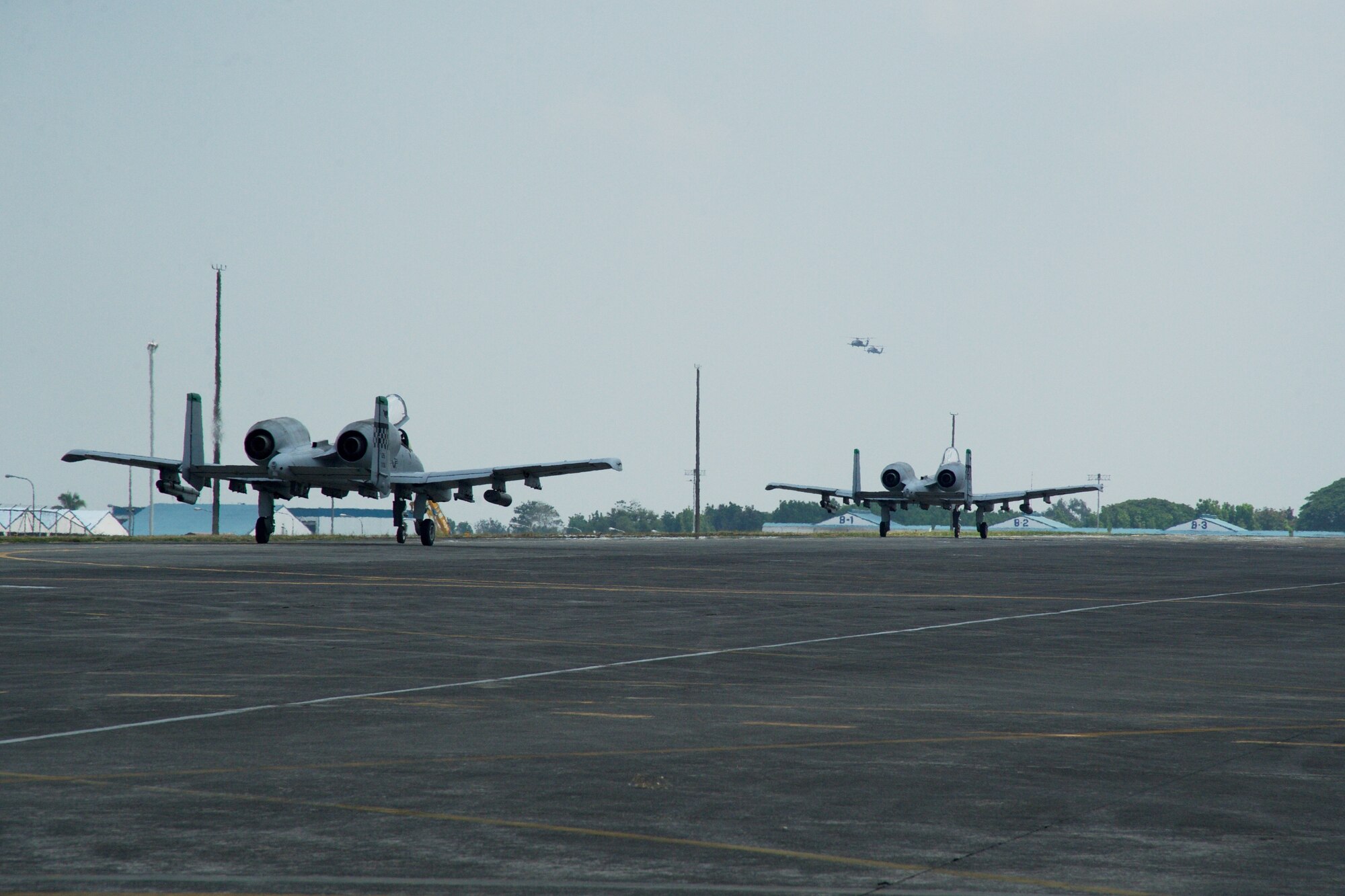 Two U.S. Air Force A-10C Thunderbolt II 
aircraft and two HH-60G Pave Hawks arrive at Clark Air Base, Philippines after conducting and supporting the final U.S. Pacific Command Air Contingent air and maritime domain awareness mission April 28, 2016. The A-10s flew in international waters west of the Philippines, providing greater and more transparent air and maritime situational awareness to ensure safety for military and civilian activities in international waters and airspace. While the A-10s are flying, the HH-60s are aloft off the Philippine coast, ensuring they are available to provide personnel recovery support in the event one of the A-10s experienced a problem. (U.S. Air Force photo by Capt. Susan Harrington)
