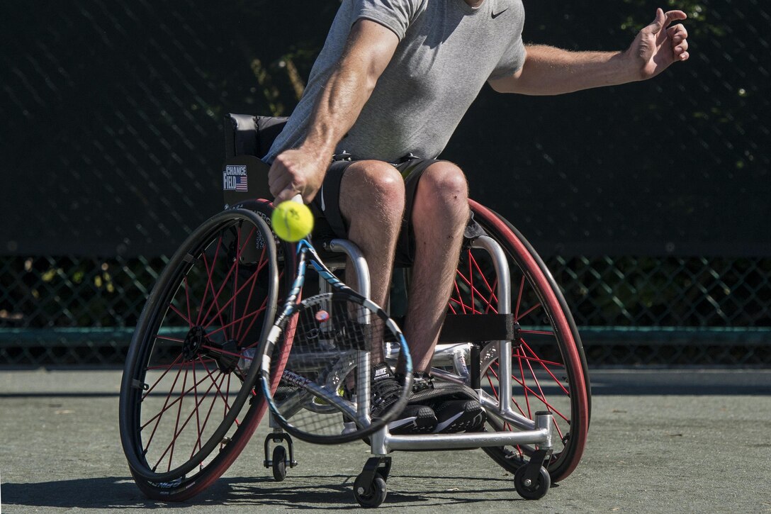 Retired Navy Seaman Austin Field trains in wheelchair tennis for the 2016 Invictus Games at the ESPN Wide World of Sports complex at Walt Disney World in Orlando, Fla., May 5, 2016. Preliminary rounds of competition between teams from 15 countries have started in 10 sports for the event, which runs through May 12. Photo by Roger Wollenberg