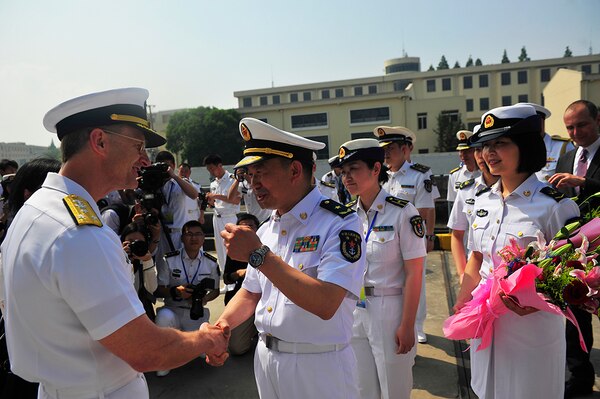 SHANGHAI (May 6, 2016) - Commander U.S. 7th Fleet, Adm. Joseph Aucoin, is greeted on the pier by the People's Liberation Army (Navy) during a welcoming ceremony in Shanghai. Blue Ridge is conducting a regularly scheduled port visit during its patrol of the 7th Fleet area of operations strengthening and fostering relationships in the Indo-Asia-Pacific region. 